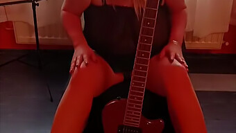 Amateur Female Masturbates With Guitar Next To Her Breasts