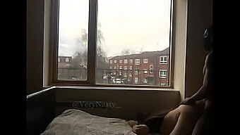 A Naughty Slut Getting Fucked By A Bbc By The Window For Public Display